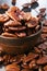 Bowl with pecan nuts on wooden table