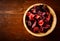 Bowl of potpourri on dark wooden table