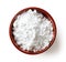 Bowl of powder sugar on white background, from above