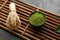 Bowl with powdered matcha tea on bamboo mat