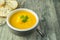 A bowl of pumpkin potato vegetable soup
