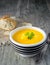 A bowl of pumpkin potato vegetable soup