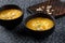 Bowl of pumpkin soup on dark background,top view.