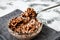 Bowl with quick breakfast of chocolate cornflakes with fresh milk on kitchen towel, spoon with flakes copy space