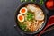 Bowl of Ramen With Hard Boiled Eggs and Noodles, Flavorful Japanese Dish