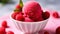 a bowl of raspberries and ice cream