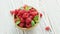 Bowl with raspberries and leaves