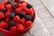 Bowl of Raspberry and Blackberry Gummy Candies on a Rustic Wooden Table