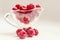 Bowl of raspberry on the white background. Horizontal image, copy space, close-up, macro