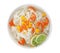 Bowl with rice noodles, shrimps and vegetables on white background