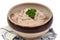 Bowl of rillettes with a sprig of parsley