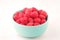 A bowl with ripe bright raspberries