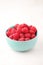 A bowl with ripe bright raspberries