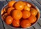 Bowl of ripe orange clementine fruit