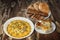 Bowl Of Russian Salad With Baguette Slices And Pitta Bread Loafs With Spinach Cheese Pie Set On Old Wooden Garden Table