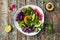 Bowl salad with halloumi cheese, avocado, cucumber, chickpeas, watermelon radish, potato purple sweet. Buddha bowl, healthy and