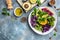 Bowl salad with halloumi cheese, avocado, cucumber, chickpeas, watermelon radish, potato purple sweet. Buddha bowl, healthy and