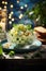 A bowl of salad on a plate with bread. Spanish dish, ensaladilla rusa.