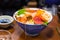 Bowl of sashimi, Japanese raw seafood, including shrimp, tuna, c