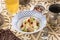 Bowl of sauerkraut with carrot and cranberries and glass of lemonade on oriental wooden table