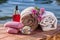 Bowl with sea salt, bottles with aromatic oil, soap, wild flower