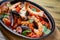 Bowl of seafood, prawns, shrimps, fish, tomatoes