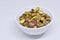 Bowl of Shelled Pistachios with White Background