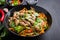 Bowl of soba noodles with beef and vegetables. Asian food.