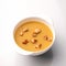 Bowl of soup with curry and croutons on white background. Spicy oriental dish. Pan-Asian cuisine. Top view