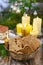 Bowl of speculaas biscuits, golden candles in the background.