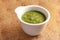 A bowl of spicy green chutney