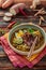 Bowl of spicy mee rebus with chopsticks, malaysian cuisine