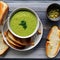 A bowl of split pea soup with a side of ham sandwich1, Generative AI