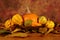 Bowl of squashes with dried leaves