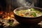 A bowl of steaming chicken soup with carrots, celery, and onions. The soup is simmering on a wooden table