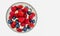 Bowl of strawberries, rasberries and blueberries isolated