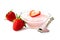 Bowl of strawberry yogurt with spoon and berries over white