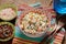 Bowl of Surimi Seafood Salad with sweet corn, cucumbers, boiled eggs and mayonnaise