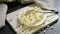 Bowl of sweet cottage cheese dessert on wooden table.