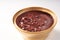 Bowl of sweet and fresh red bean paste on white background, Cantonese style dessert