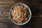 Bowl of tasty buckwheat on wooden table