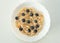 Bowl with tasty cooked oatmeal porridge with banana and fresh blueberries. Healthy breakfast every morning. Healthy lifestyle and