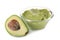 Bowl with tasty guacamole and half of ripe avocado on white background