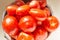 Bowl of tomatoes being washed