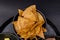 Bowl of tortilla chips on a traditional Mexican comal