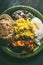 Bowl with traditional Indian foods, top view