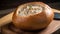 Bowl of Tuna Cream Soup in Bread Bowl on Cutting Board