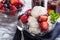 Bowl of Vanilla Ice Cream With Blueberries and Strawberries