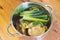 Bowl of vegetable soup ingridients on wooden table, healthy nutrition