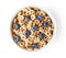 Bowl of whole grain cheerios cereal with blueberries isolated on